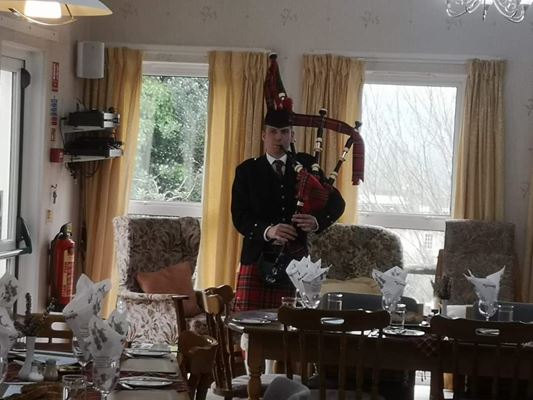 Burns Night Piper playing bagpipes