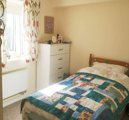 Bright sunny resident bedroom at Abbeyfield House